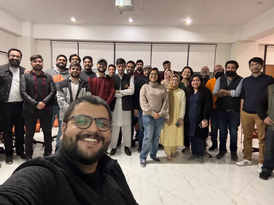 About twenty-five people together in a meeting room at the end of a Product Soch Islamabad session
